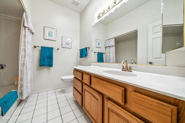 full bathroom with tile patterned floors, shower / bathtub combination with curtain, vanity, and toilet