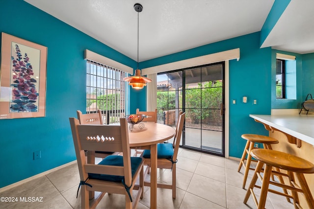 tiled dining area with a wealth of natural light