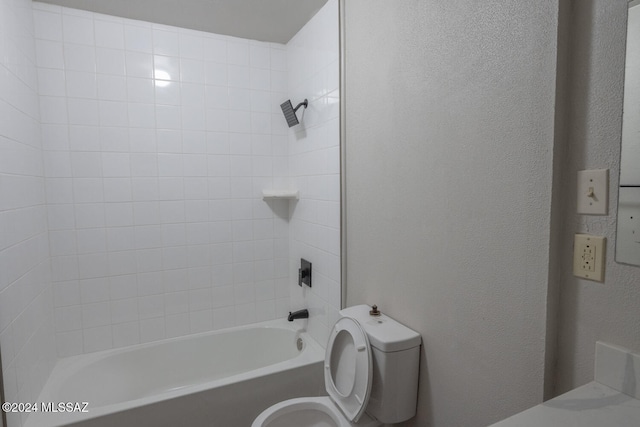 bathroom featuring toilet and shower / washtub combination