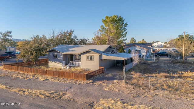 view of front of property featuring a carport