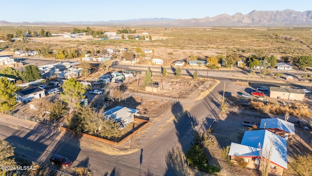 birds eye view of property with a mountain view