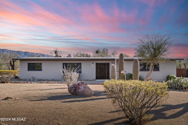 ranch-style house featuring a mountain view