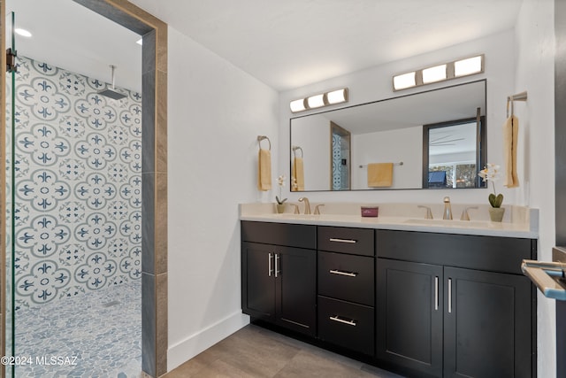 bathroom featuring walk in shower and vanity