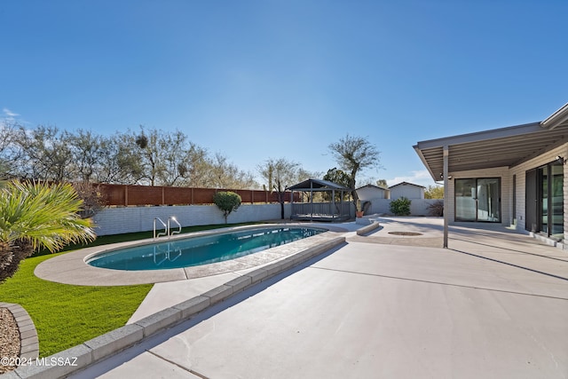 view of swimming pool featuring a patio area