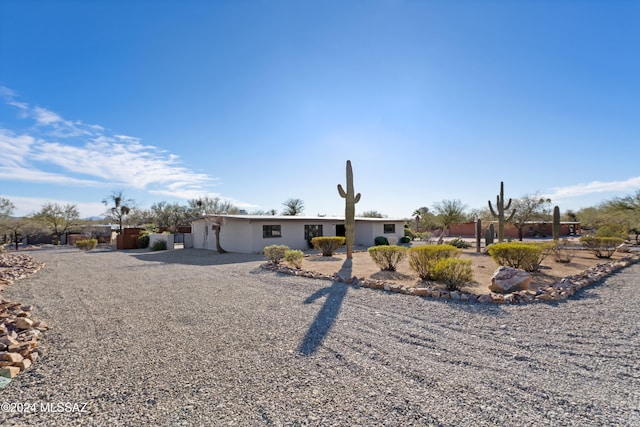 back of property featuring a garage