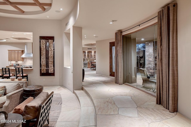 hallway featuring coffered ceiling