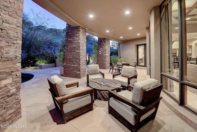 view of patio terrace at dusk