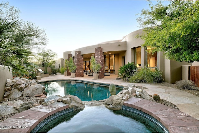 view of swimming pool featuring a patio