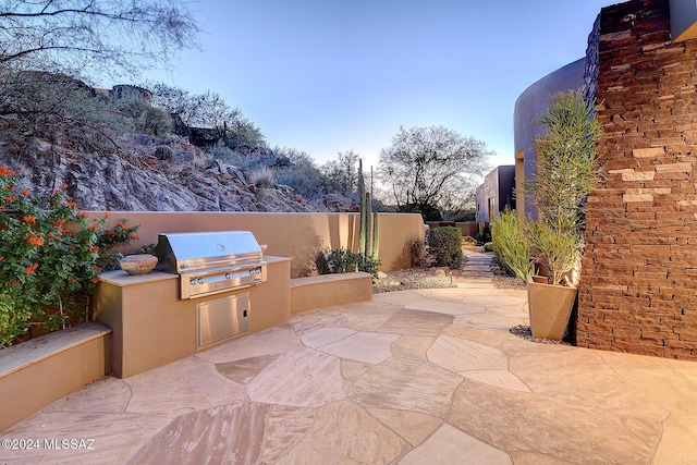 view of patio with a grill and area for grilling