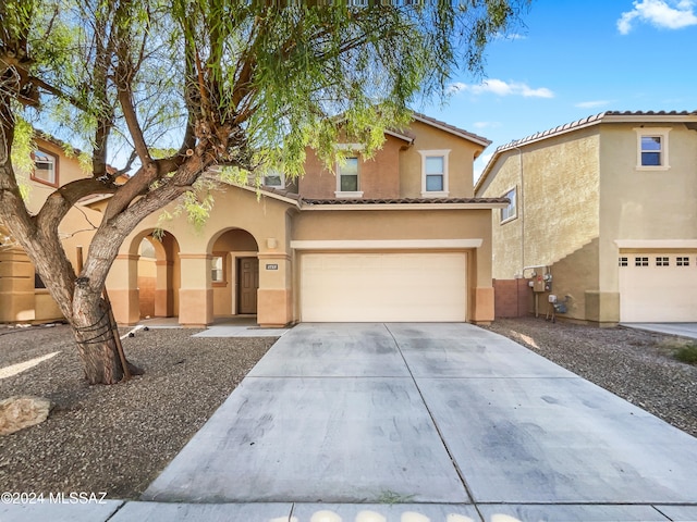 view of front of property with a garage