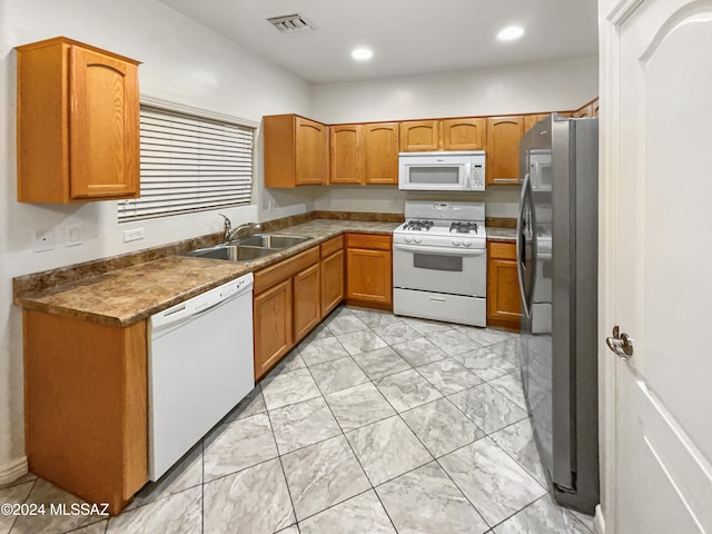 kitchen with sink and white appliances