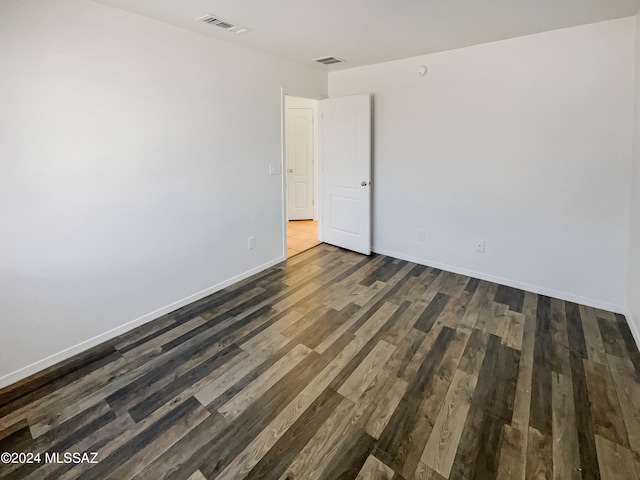 empty room featuring dark hardwood / wood-style floors