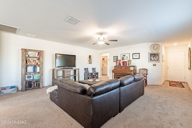 living room featuring ceiling fan and light colored carpet