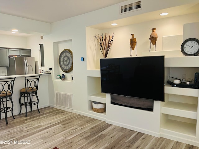 living room with light hardwood / wood-style floors