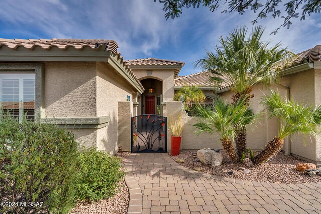 mediterranean / spanish-style home with a garage