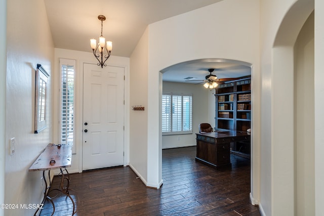 foyer featuring ceiling fan, a wealth of natural light, and dark hardwood / wood-style flooring