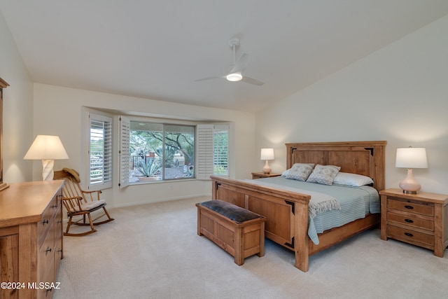 carpeted bedroom featuring lofted ceiling and ceiling fan