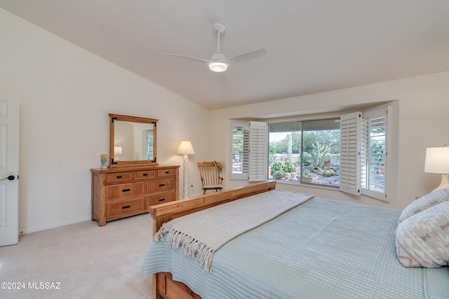 carpeted bedroom featuring lofted ceiling and ceiling fan