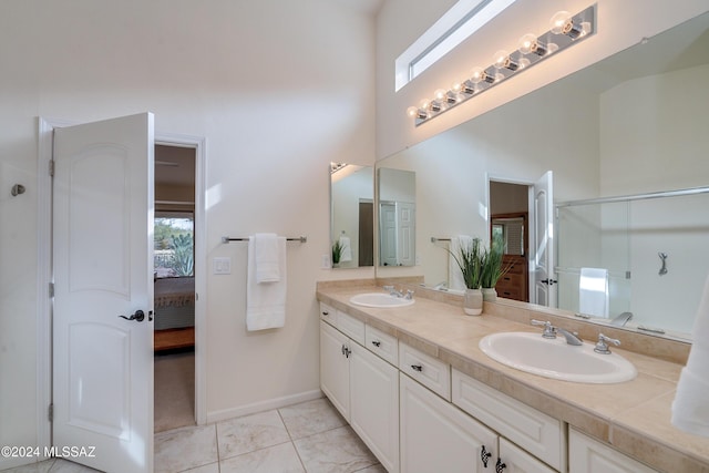 bathroom with vanity, tile patterned floors, and a healthy amount of sunlight