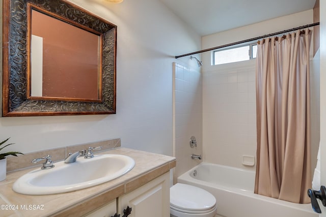 full bathroom with shower / bathtub combination with curtain, vanity, and toilet