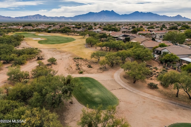 birds eye view of property featuring a mountain view