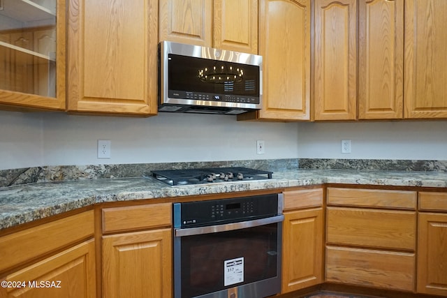 kitchen featuring a chandelier and stainless steel appliances