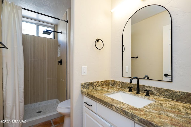 full bathroom with toilet, tile patterned floors, a shower stall, and vanity