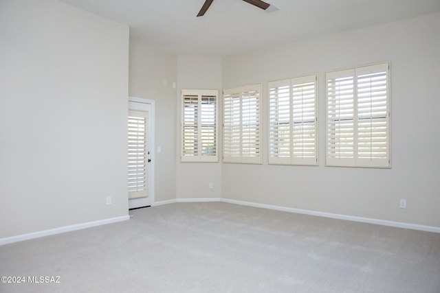 carpeted empty room with ceiling fan