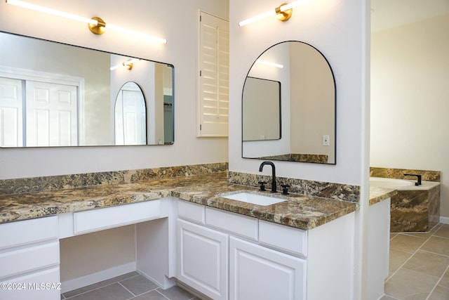 bathroom with tile patterned flooring and vanity