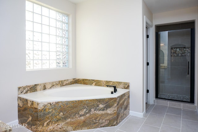 bathroom featuring tile patterned floors and plus walk in shower