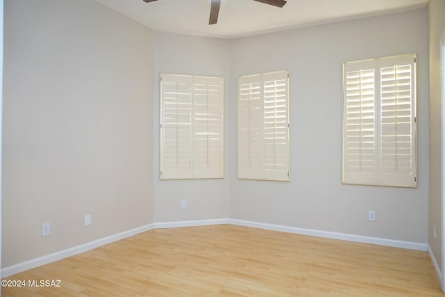 spare room featuring ceiling fan and light hardwood / wood-style flooring