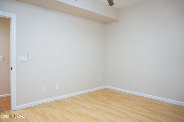 empty room with hardwood / wood-style floors