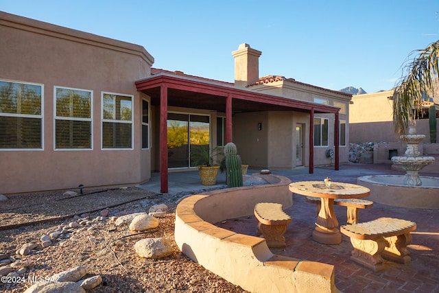 back of house with a patio area