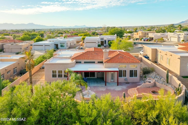 exterior space with a residential view and a mountain view