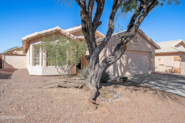 view of side of home with a garage