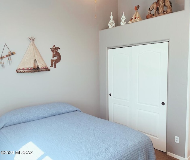 bedroom with carpet floors and a closet