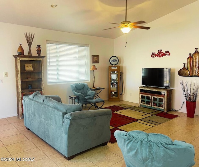 living room featuring ceiling fan, light tile patterned floors, and lofted ceiling