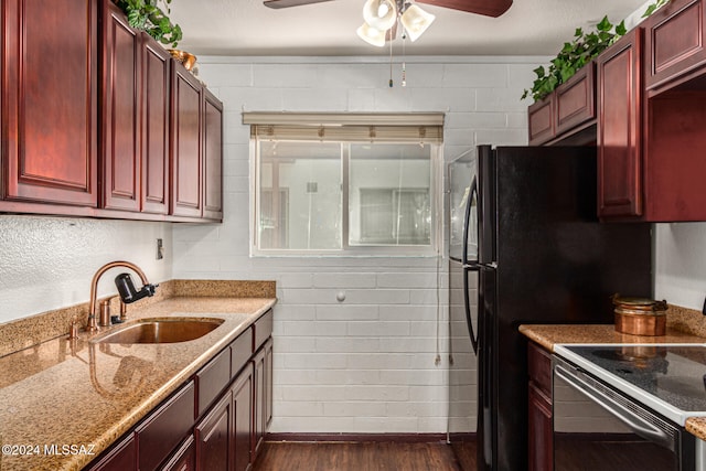 kitchen with sink, light stone counters, ceiling fan, stainless steel range with electric cooktop, and dark hardwood / wood-style flooring