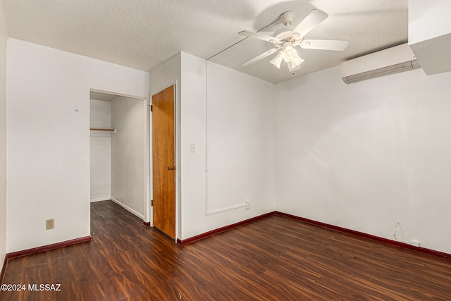 unfurnished bedroom featuring dark hardwood / wood-style flooring, a textured ceiling, and ceiling fan