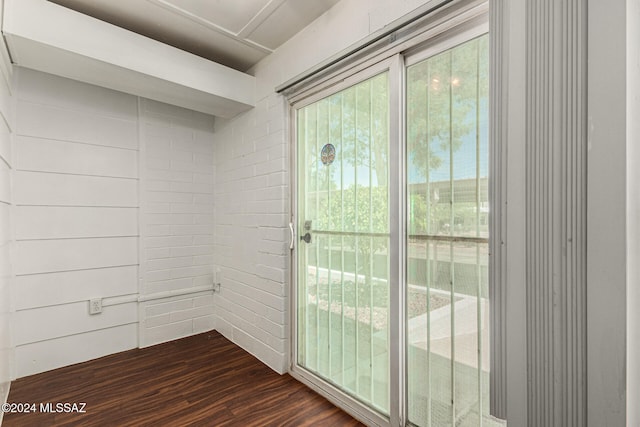 doorway featuring dark hardwood / wood-style flooring