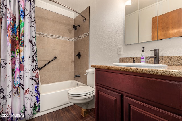 full bathroom with hardwood / wood-style floors, vanity, toilet, and shower / tub combo