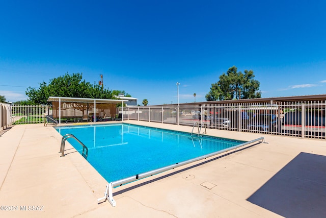 view of swimming pool with a patio