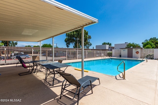 view of swimming pool with a patio area