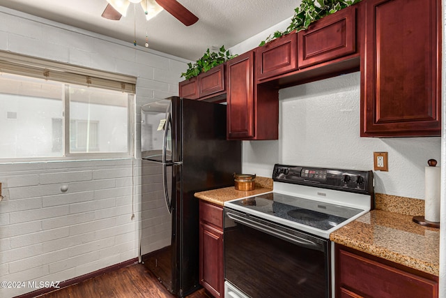 kitchen with white range with electric cooktop, dark wood-type flooring, light stone counters, a textured ceiling, and ceiling fan