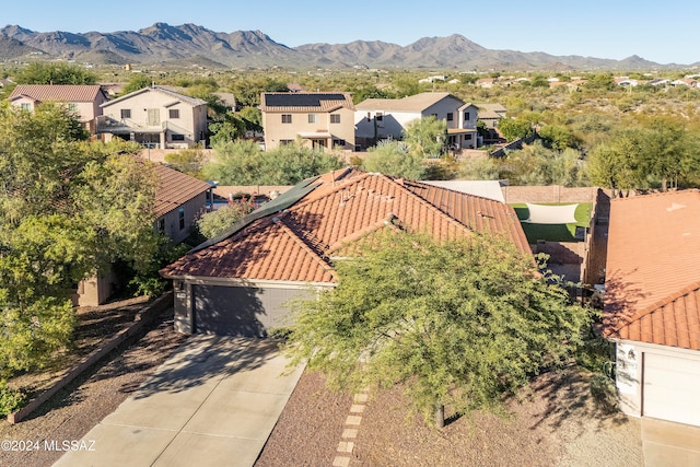 birds eye view of property featuring a mountain view