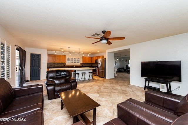 living room featuring ceiling fan