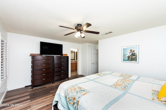 bedroom with ceiling fan, dark hardwood / wood-style flooring, and ensuite bath