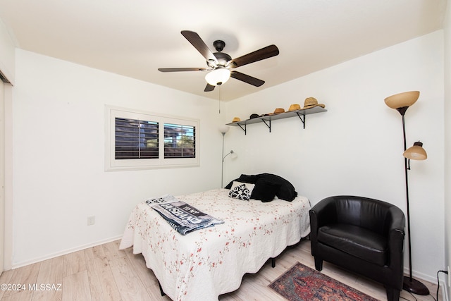 bedroom featuring ceiling fan and light hardwood / wood-style flooring