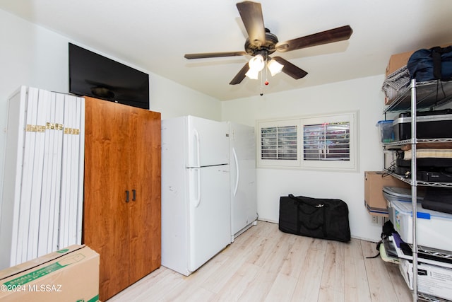 interior space with ceiling fan and light hardwood / wood-style floors