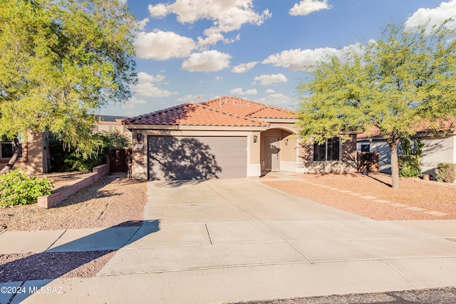 mediterranean / spanish-style home featuring a garage